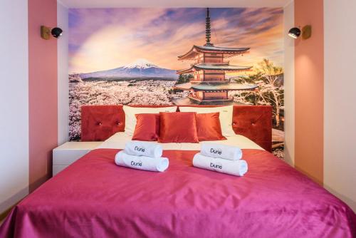 Postel nebo postele na pokoji v ubytování Pokoje, Apartamenty, Domki nad Morzem Dune Resort Łeba