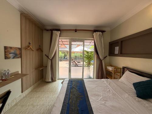 Postel nebo postele na pokoji v ubytování Hello Kampot Resort