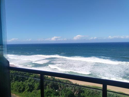 a view of the ocean from a balcony at 504 Coral Reef in La Mercy