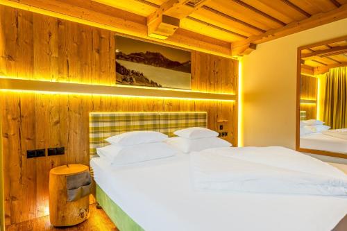 Postel nebo postele na pokoji v ubytování Hotel Kirchbichlhof