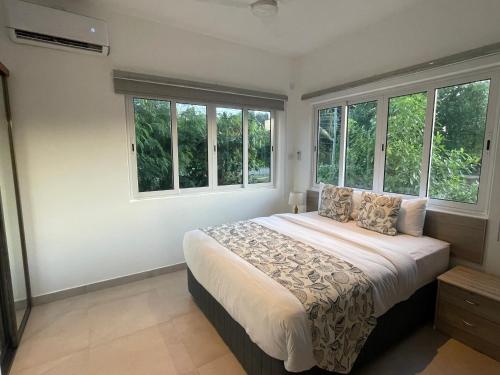 Postel nebo postele na pokoji v ubytování Tropic Villa Annex
