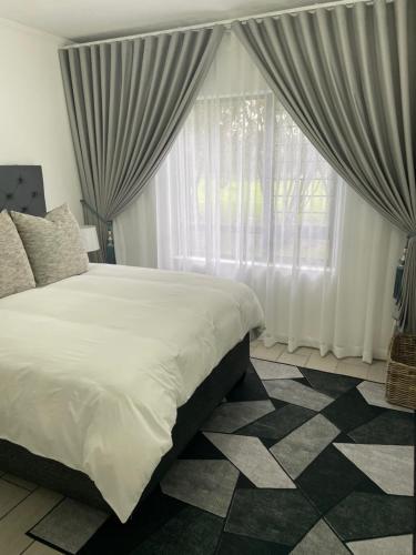 Letto o letti in una camera di Jackal Luxury Escape