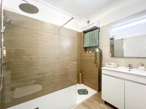 a bathroom with a shower and a sink at Apartment Praia Rocha Candimar Salvia in Portimão
