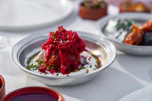 a bowl of food on top of a table at Taskonaklar in Uchisar