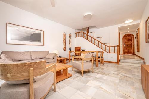 a living room with a couch and a table at Parque Santiago III Official in Playa de las Americas