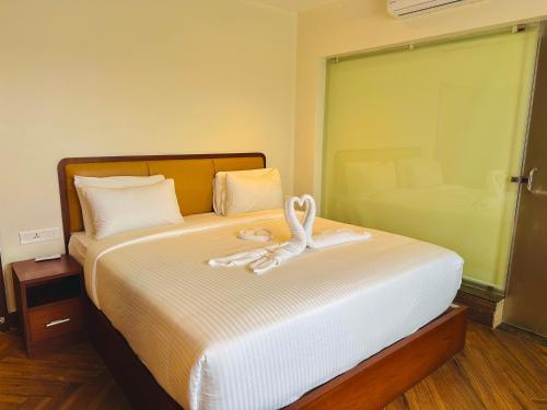 Letto o letti in una camera di Talenresort Vythiri Villas