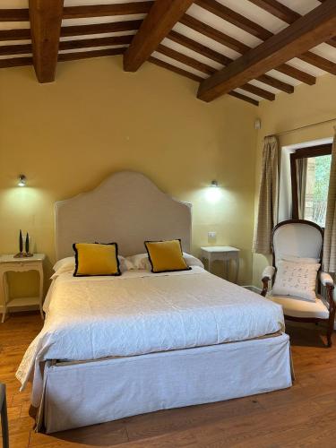 Ένα ή περισσότερα κρεβάτια σε δωμάτιο στο Saturnia Country Villas
