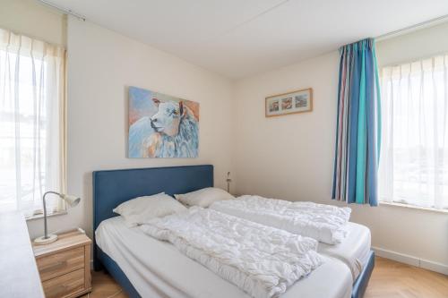 Ένα ή περισσότερα κρεβάτια σε δωμάτιο στο Appartementencomplex Juliana 36