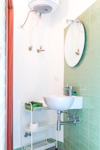 a bathroom with a sink and a mirror at Casa Falerno in Città di Castello