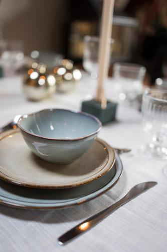 a bowl on a plate on a table at Chic Penthouse Grand-Place in Brussels