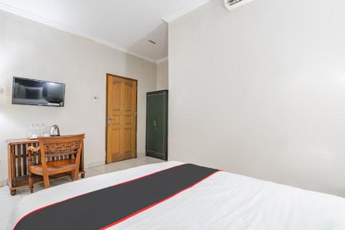 Ένα ή περισσότερα κρεβάτια σε δωμάτιο στο Dancenter Pusat Kota Pekanbaru Near Masjid Al-Hidayah Simpang Baru