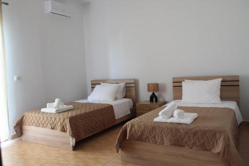 Ένα ή περισσότερα κρεβάτια σε δωμάτιο στο Villa Nefeli