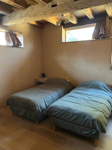 Postel nebo postele na pokoji v ubytování Gite les 4 Saisons - chambre Eté