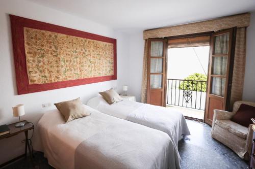 En eller flere senge i et værelse på Casa Corredera - Hello Vejer