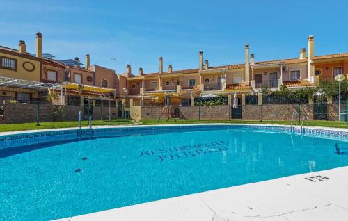 a large swimming pool in front of a building at 5 Bedroom Cozy Home In El Portil in El Portil