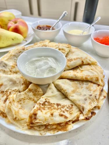 a plate of chapati with a bowl of dip at Monument1880 in Tbilisi City