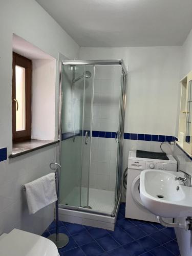 a bathroom with a shower and a sink at Casa Franchino in Pollica