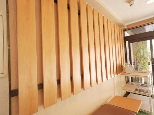 a room with wooden panels on the wall at グリーンホテル米子 Green Hotel Yonago in Yonago
