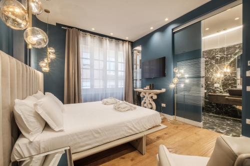 Katil atau katil-katil dalam bilik di Luxury Suites in the Heart of Cagliari