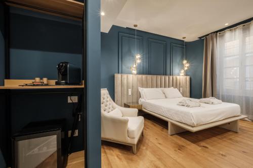 Katil atau katil-katil dalam bilik di Luxury Suites in the Heart of Cagliari