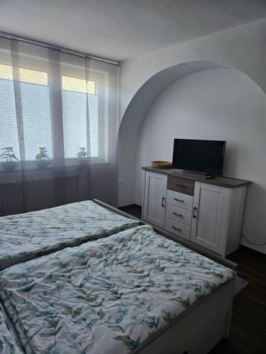 Ένα ή περισσότερα κρεβάτια σε δωμάτιο στο FeWo Ruhrpott
