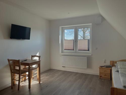 Μια τηλεόραση ή/και κέντρο ψυχαγωγίας στο A & B Apartment und -Zimmervermietung eGbr