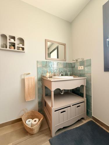 a bathroom with a sink and a mirror at Casa Julia in Vila Nova de Cerveira