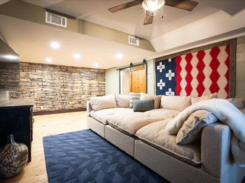 a living room with a large couch in a room at Birch Bay in Nisswa