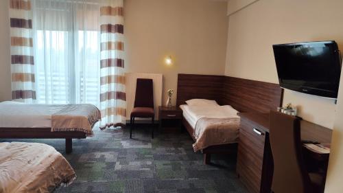 Una cama o camas en una habitación de Taurus Ładna