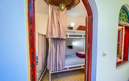 a mirror in a room with a bunk bed at Tangiers Hostel in Tangier