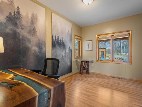 a bedroom with a large painting on the wall at Longbow Lodge in Walker