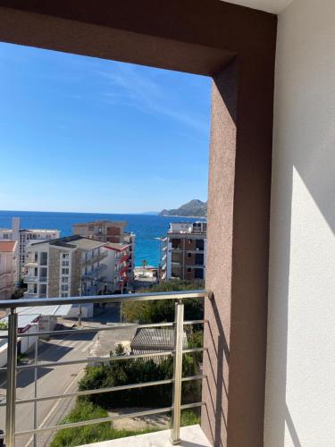 a balcony with a view of the ocean at Sunrise apartmani in Bar