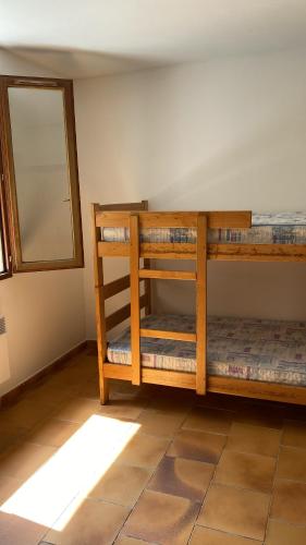 En eller flere senge i et værelse på Gite d'étape Auberge Luna Piena