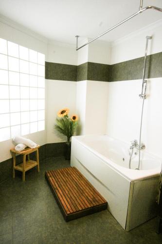 a bathroom with a large tub and a sink at Moraira Beach 1 in Moraira