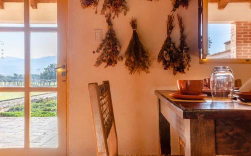 a dining room with a table and a window at La Vaca Tranquila in San Carlos
