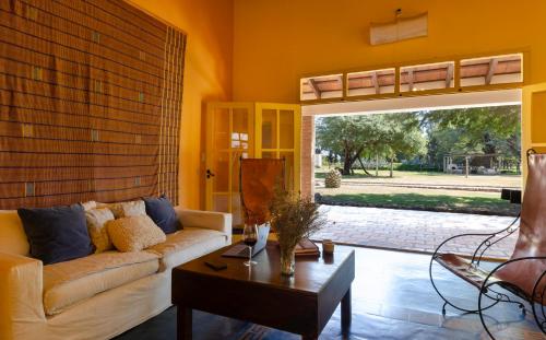 a living room with a couch and a table at La Vaca Tranquila in San Carlos
