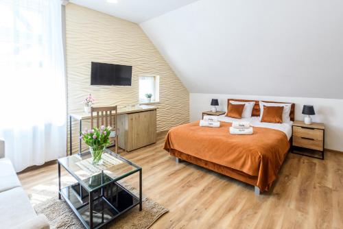 Postel nebo postele na pokoji v ubytování Pokoje, Apartamenty, Domki nad Morzem Dune Resort Łeba