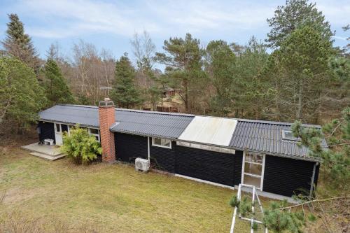 an aerial view of a house in the woods at Charming Holiday Home Near Stenstrup Beach in Nykøbing Sjælland