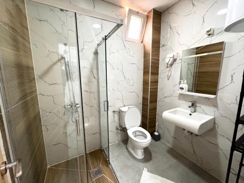 Koupelna v ubytování Hotel Alisa