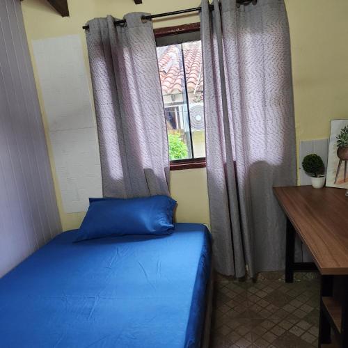 Postel nebo postele na pokoji v ubytování Dormitorio en Residencia Familiar