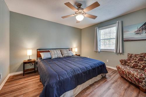 a bedroom with a bed and a ceiling fan at Branson Area Home Less Than 1 Mi to Table Rock Lake! in Kimberling City