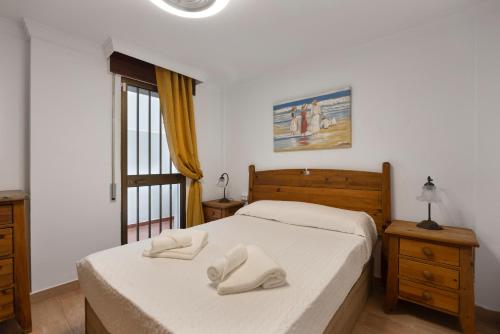 Кровать или кровати в номере Apartamento Magnolia Chiclana