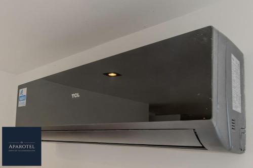 a microwave oven is attached to a ceiling at Aparotel Serviced Apartments - Stonehenge, Amesbury Town Centre in Amesbury