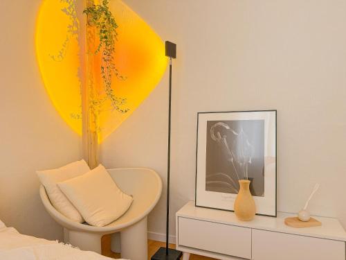 a bedroom with a bed and a chair and a picture at STAY ONDAM #3room #10guests in Seoul