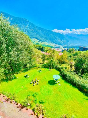 an overhead view of a field with animals in it at Sagar Heritage Resort, Near Mall Road Manali in Manāli