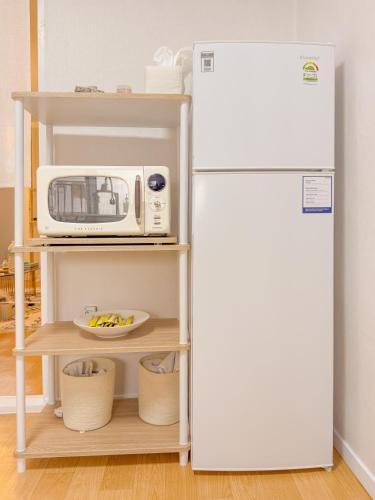 a kitchen with a refrigerator and a microwave at STAY ONDAM #3room #10guests in Seoul