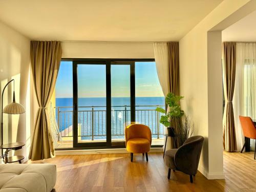 a living room with a view of the ocean at Apartments Azimut Rezevici in Budva