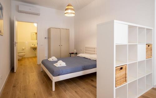 Giường trong phòng chung tại GuestHost - Casa Matisse