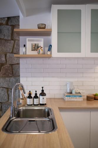 a kitchen with a sink and a counter at Traveller's Return Retreat in Fremantle