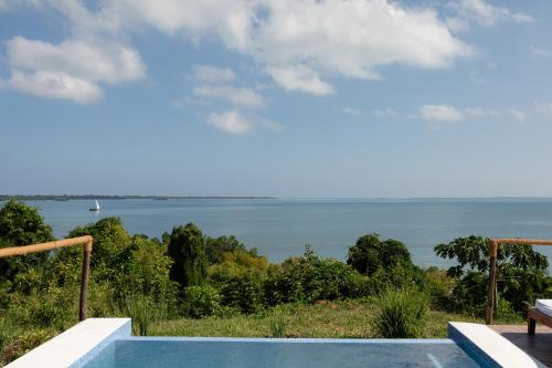 a view of the ocean from a villa at Pole Pole Bungalows in Utende